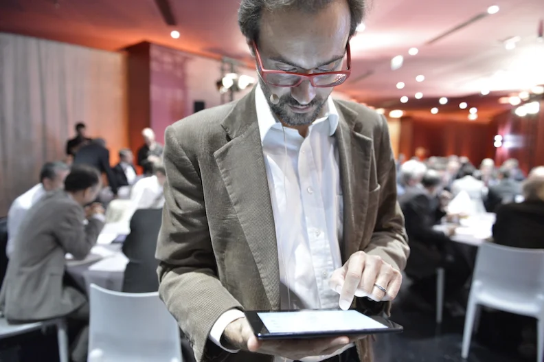 A man reading content on an iPad